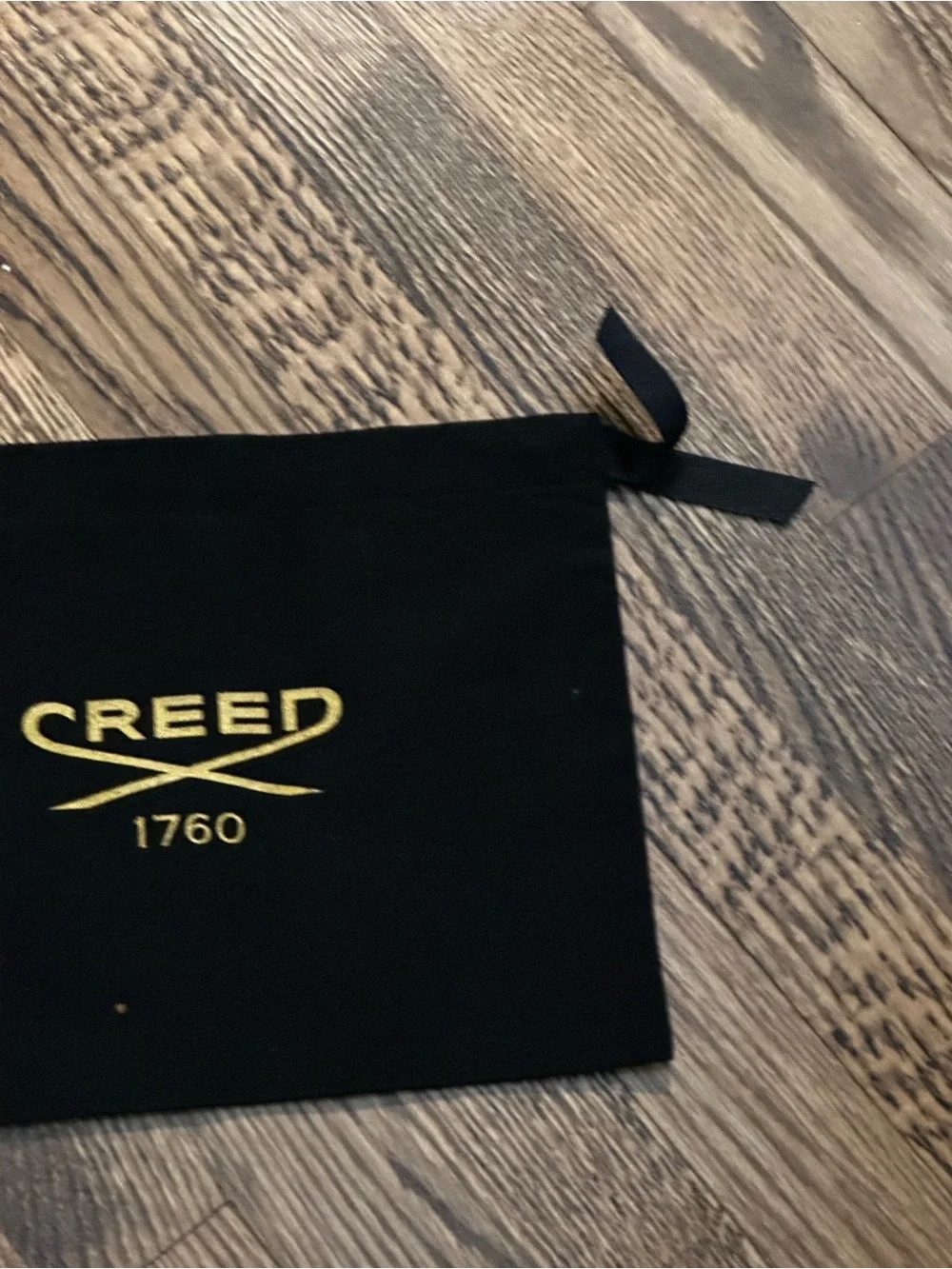 Creed Black Drawstring Pouch with Gold Logo